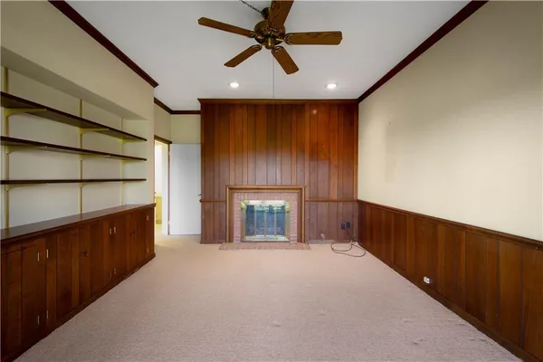 a view of an empty room and entryway