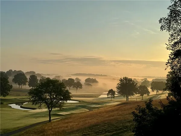 a view of a golf course with a lake