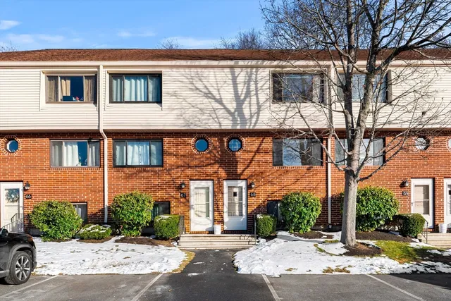 a front view of a building with street view