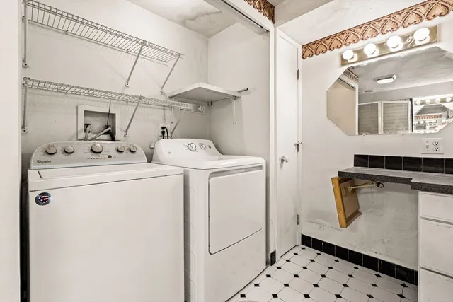 a bathroom with a granite countertop shower mirror and a sink