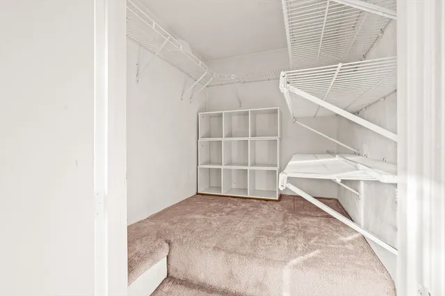 a view of an empty room with windows