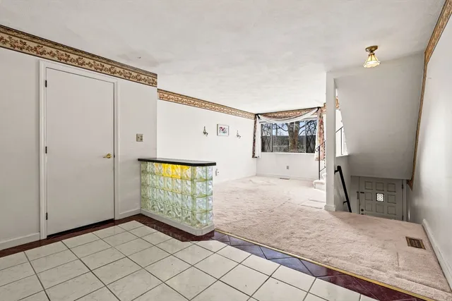 a view of an entryway with staircase