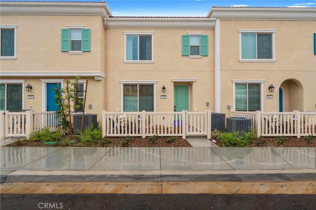 a view of a house with a fence