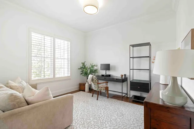 a view of a dining room with furniture window and wooden floor