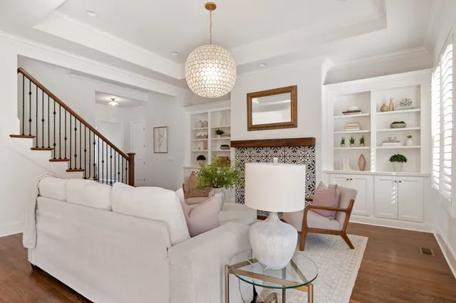 a kitchen with stainless steel appliances granite countertop a refrigerator a oven a sink counter space and chairs