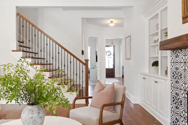 a bathroom with a granite countertop sink a mirror and a shower