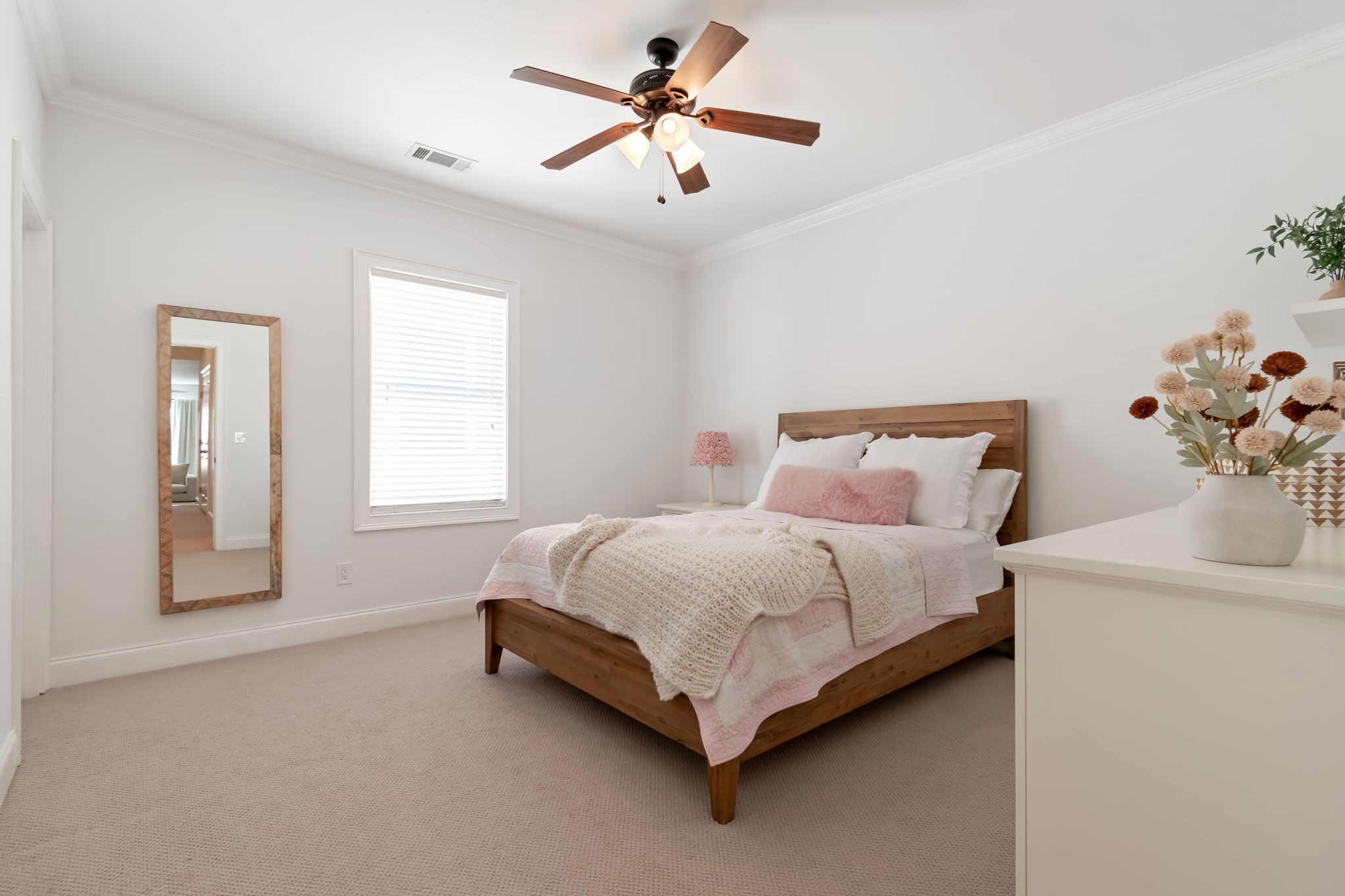 463 Avon River Road Franklin, TN 37064 - Photo 61 of 91 a bed sitting in a bedroom next to a window and a chandelier