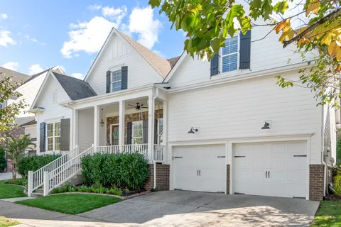 a view of a hallway view with wooden floor and staircase