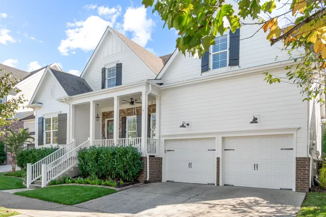 a view of a hallway view with wooden floor and staircase