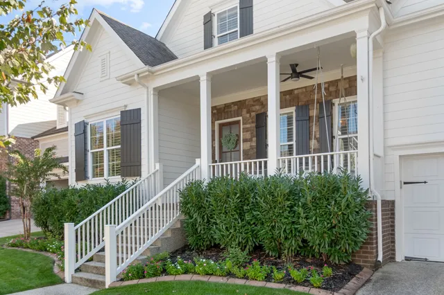 a view of a room with wooden floor and window