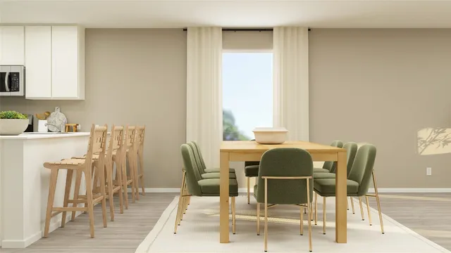 a dining room with furniture and window
