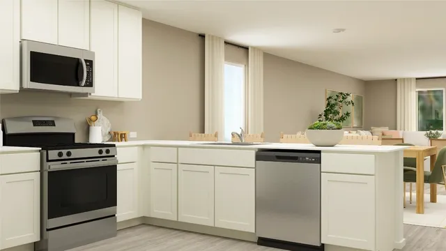 a kitchen with a sink stove and microwave