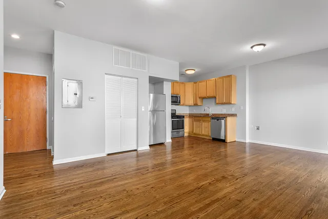 a view of kitchen with wooden floor