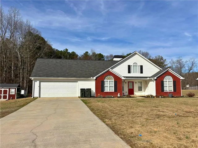 a front view of a house with a yard