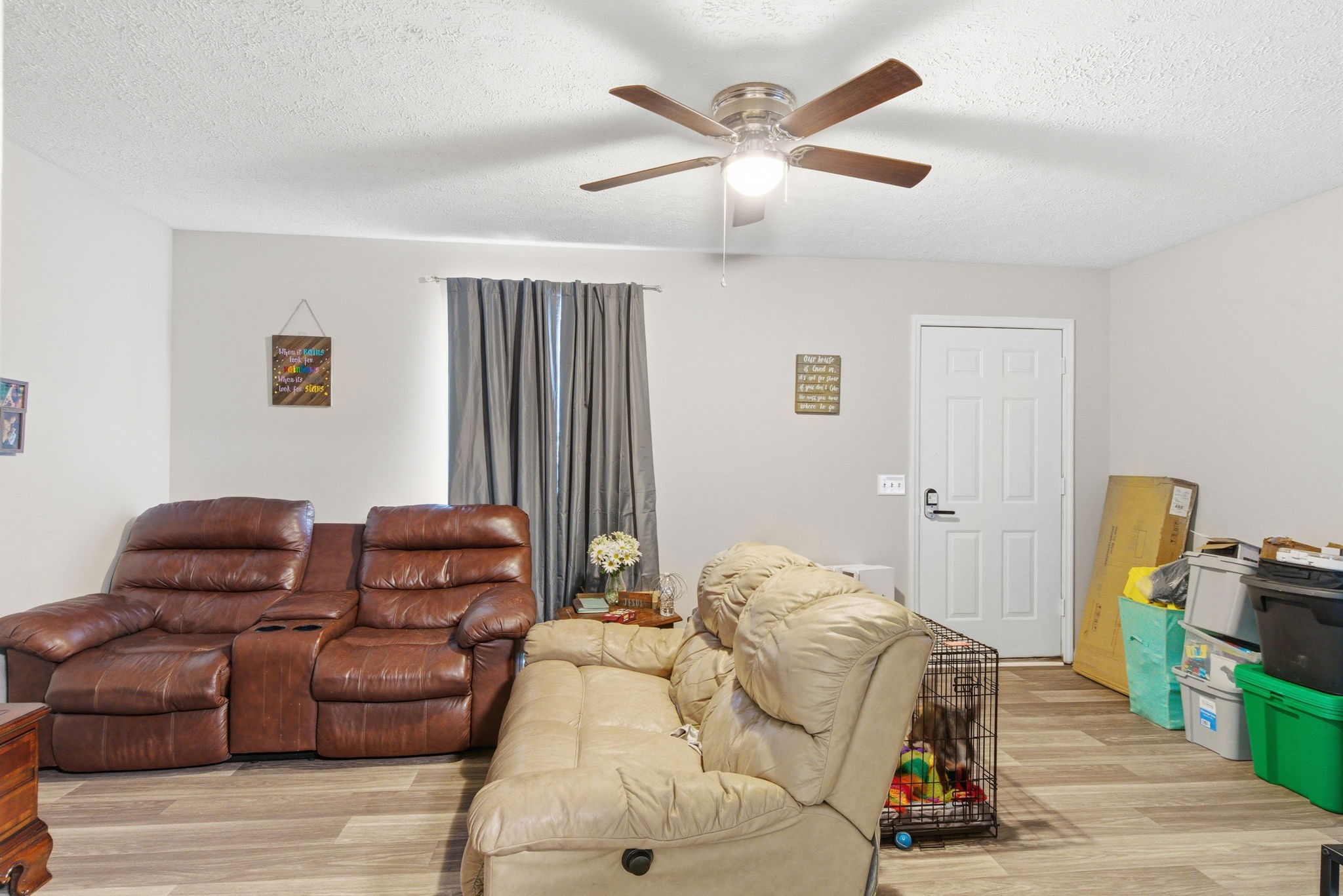 111 Gayla Court Portland, TN 37148 - Photo 29 of 47 a living room with furniture a flat screen tv and a ceiling fan