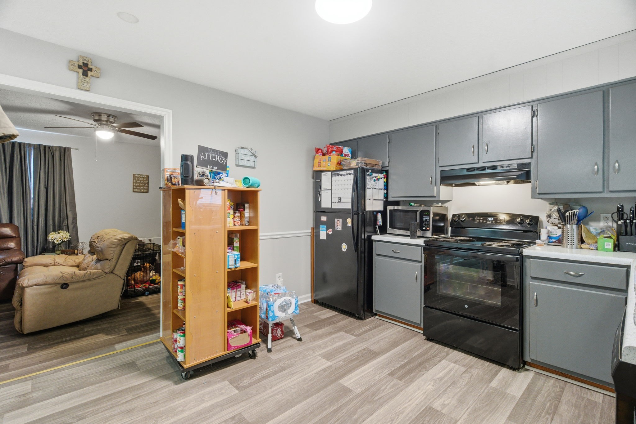 111 Gayla Court Portland, TN 37148 - Photo 33 of 47 a kitchen with a refrigerator cabinets and wooden floor