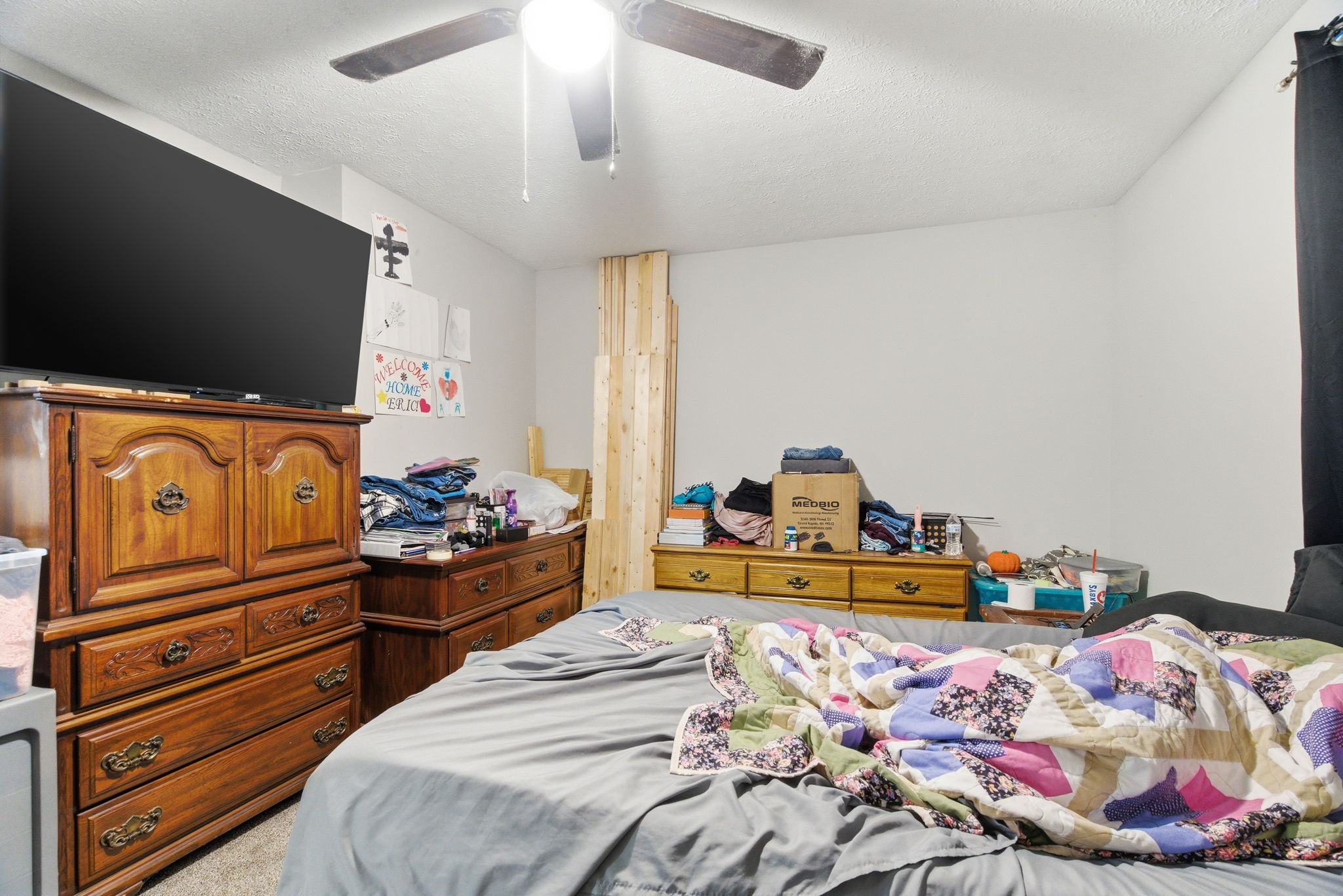 111 Gayla Court Portland, TN 37148 - Photo 42 of 47 a bedroom with a bed and flat tv screen on the dresser