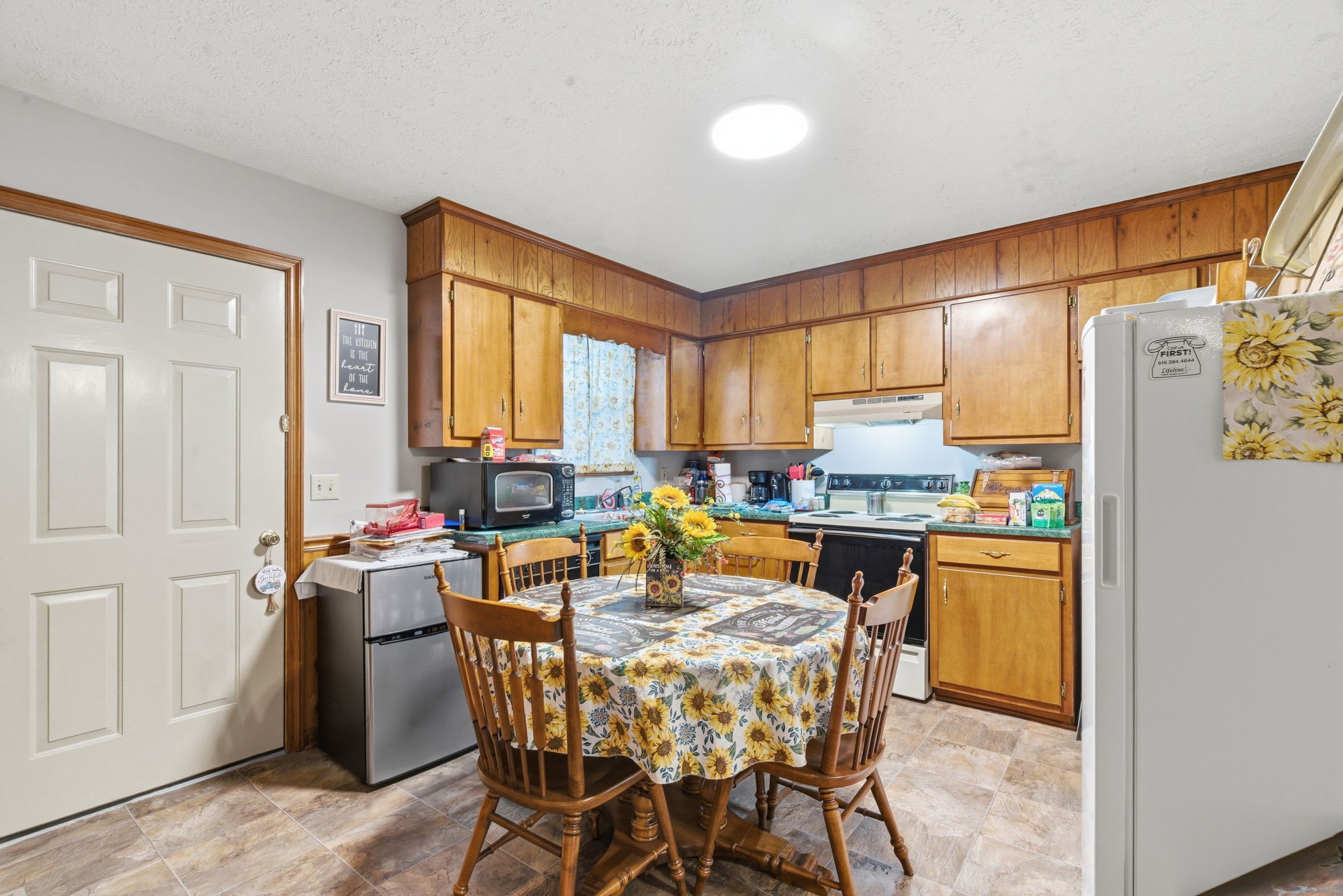 111 Gayla Court Portland, TN 37148 - Photo 8 of 47 a kitchen with a table chairs and refrigerator