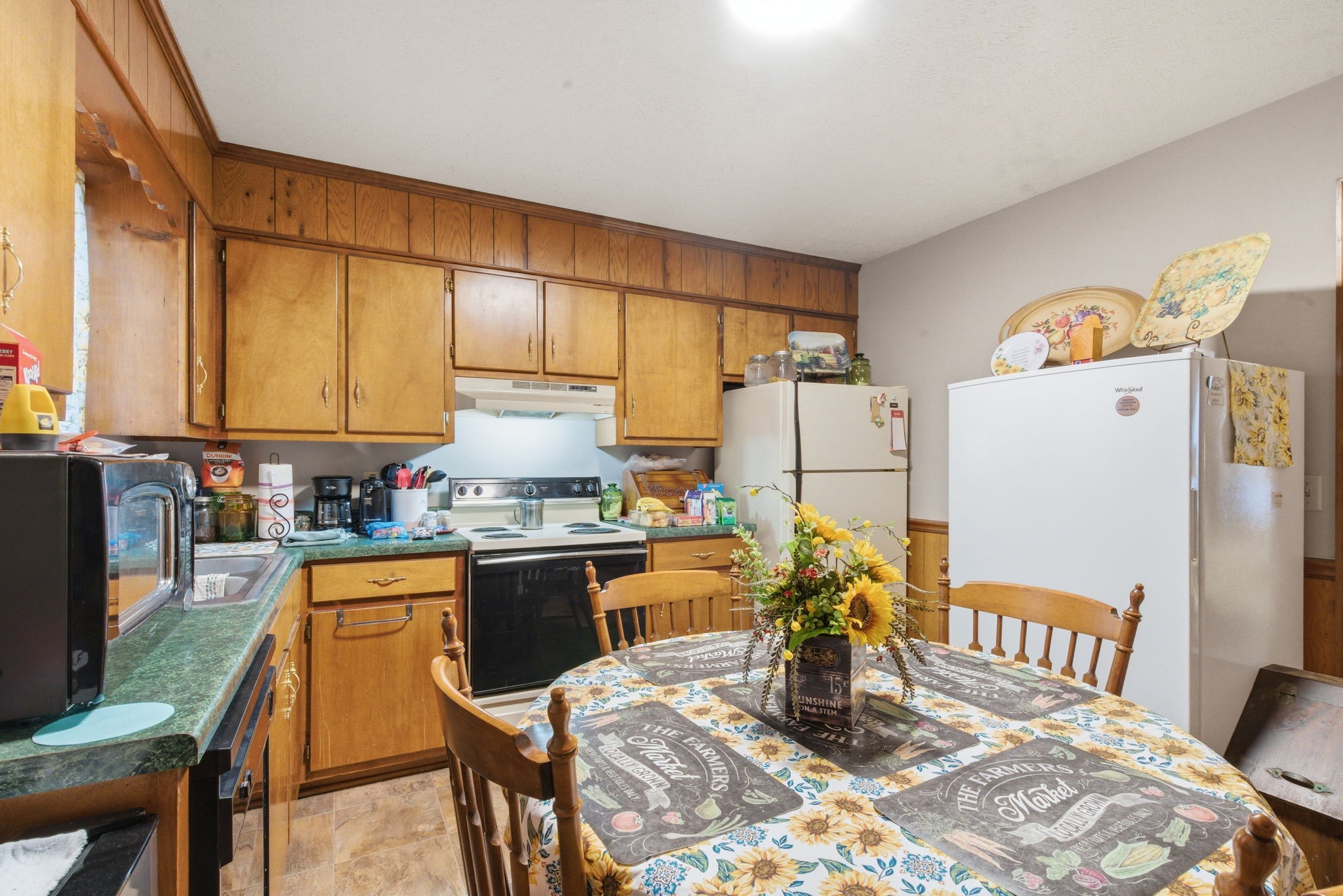 111 Gayla Court Portland, TN 37148 - Photo 9 of 47 a kitchen with stainless steel appliances granite countertop a refrigerator a stove a sink dishwasher and white cabinets with wooden floor