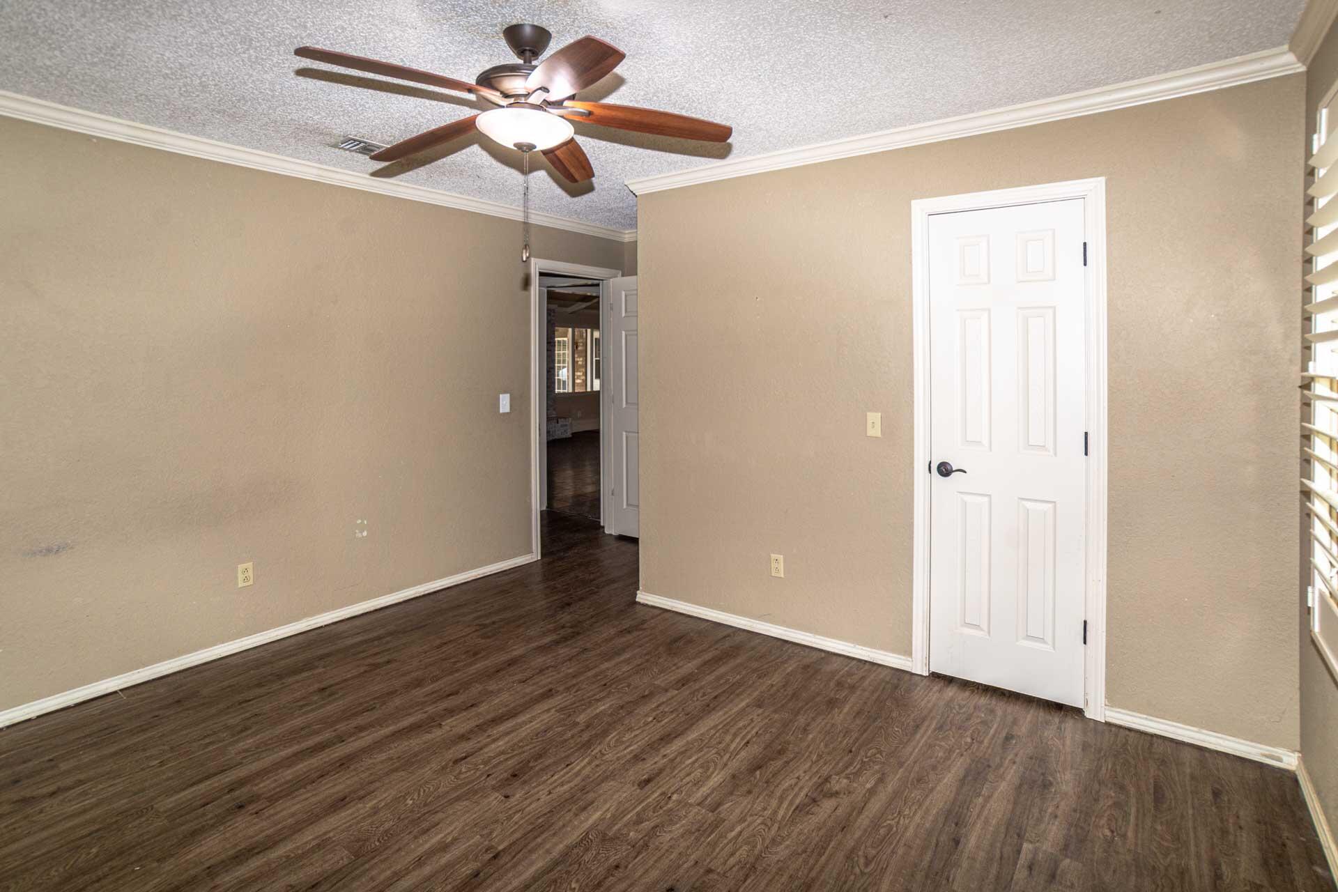 3312 77th Street Lubbock, TX 79423 - Photo 24 of 30 a view of an empty room with wooden floor