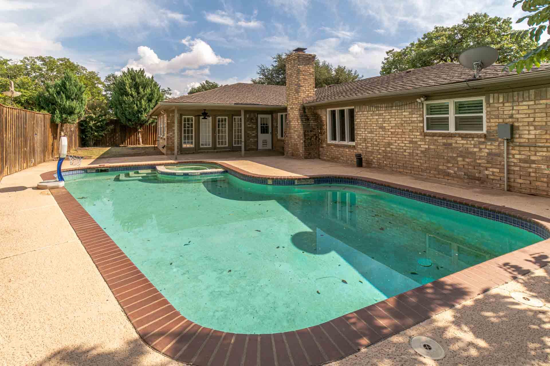 3312 77th Street Lubbock, TX 79423 - Photo 4 of 30 a view of a house with a swimming pool