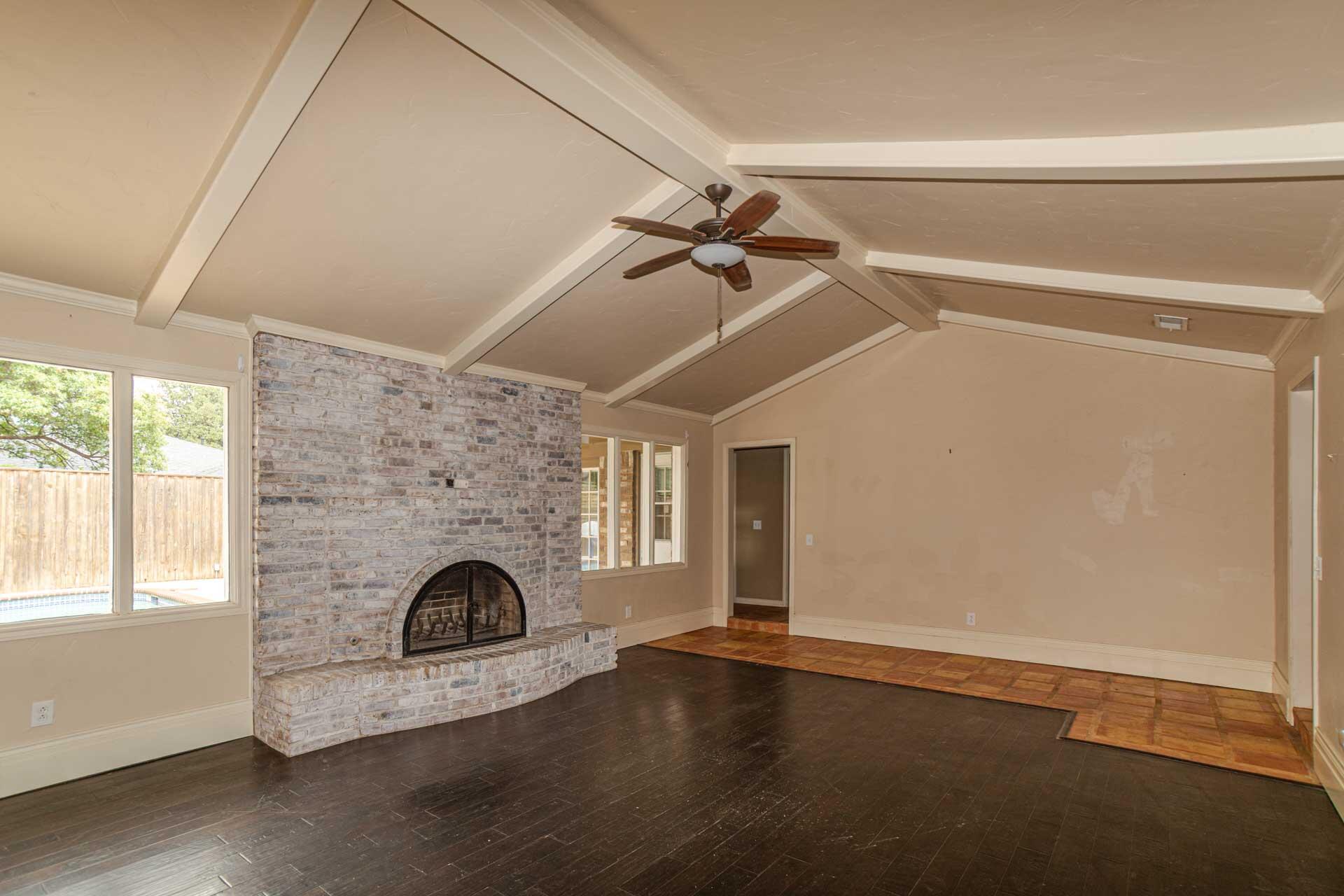 3312 77th Street Lubbock, TX 79423 - Photo 7 of 30 a view of empty room with fireplace and fan