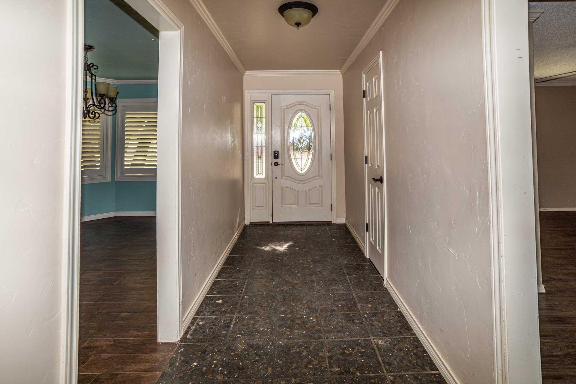 3312 77th Street Lubbock, TX 79423 - Photo 8 of 30 a view of a hallway with wooden floor and closet