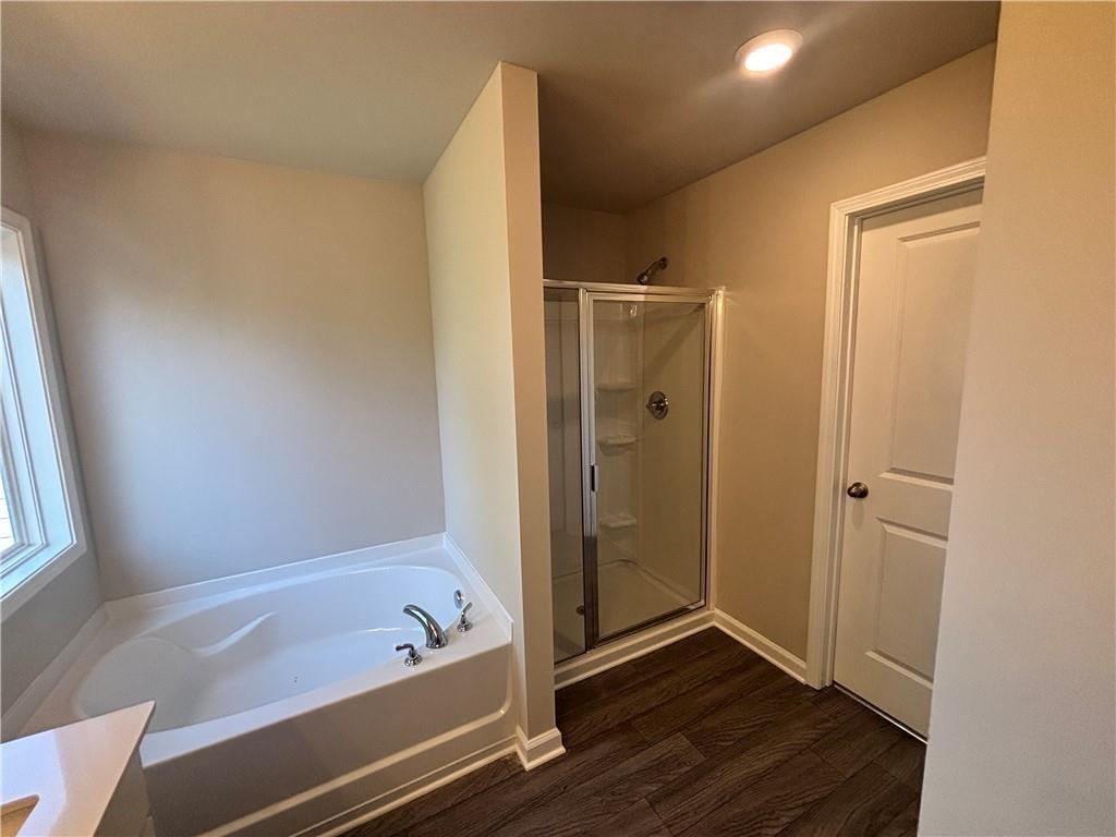 125 Mill Pond Lane Calhoun, GA 30701 - Photo 13 of 19 a bathroom with a tub shower and vanity