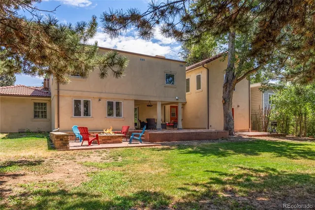 a front view of house with yard having outdoor seating