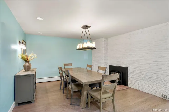 a view of a dining room with a table and chairs