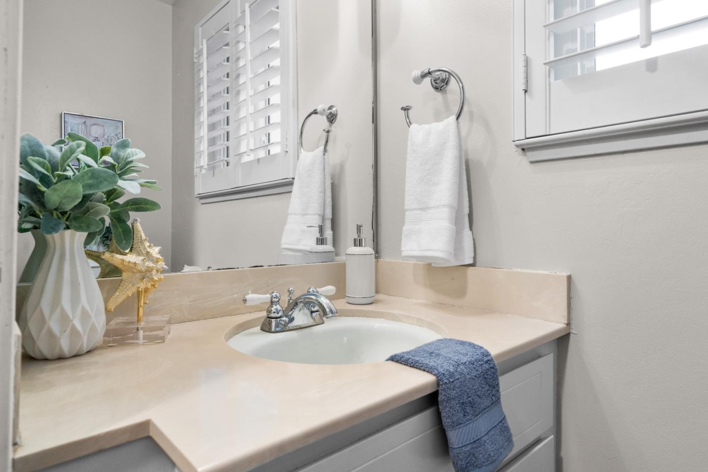 775 Steuben Drive Sunnyvale, CA 94087 - Photo 13 of 37 a bathroom with a sink and a mirror