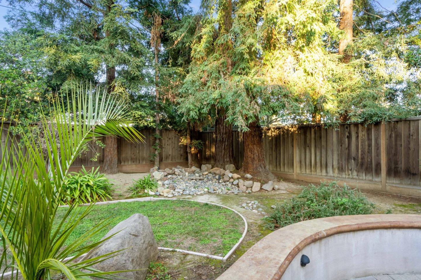 775 Steuben Drive Sunnyvale, CA 94087 - Photo 36 of 37 a view of a lake with a wooden fence