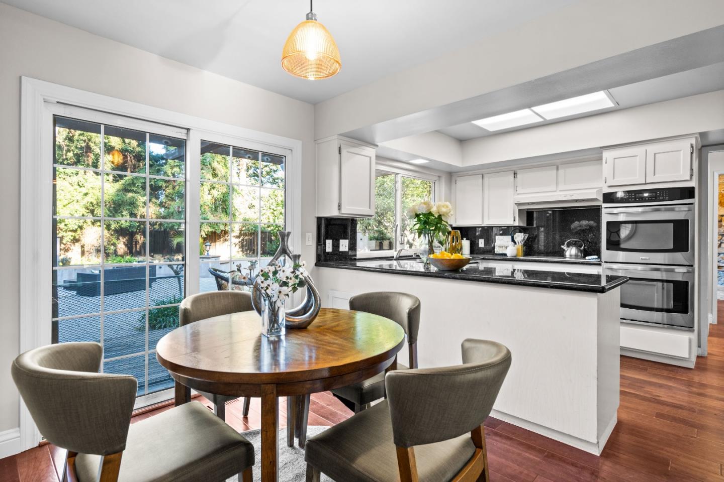 775 Steuben Drive Sunnyvale, CA 94087 - Photo 9 of 37 a kitchen with a table chairs sink and cabinets