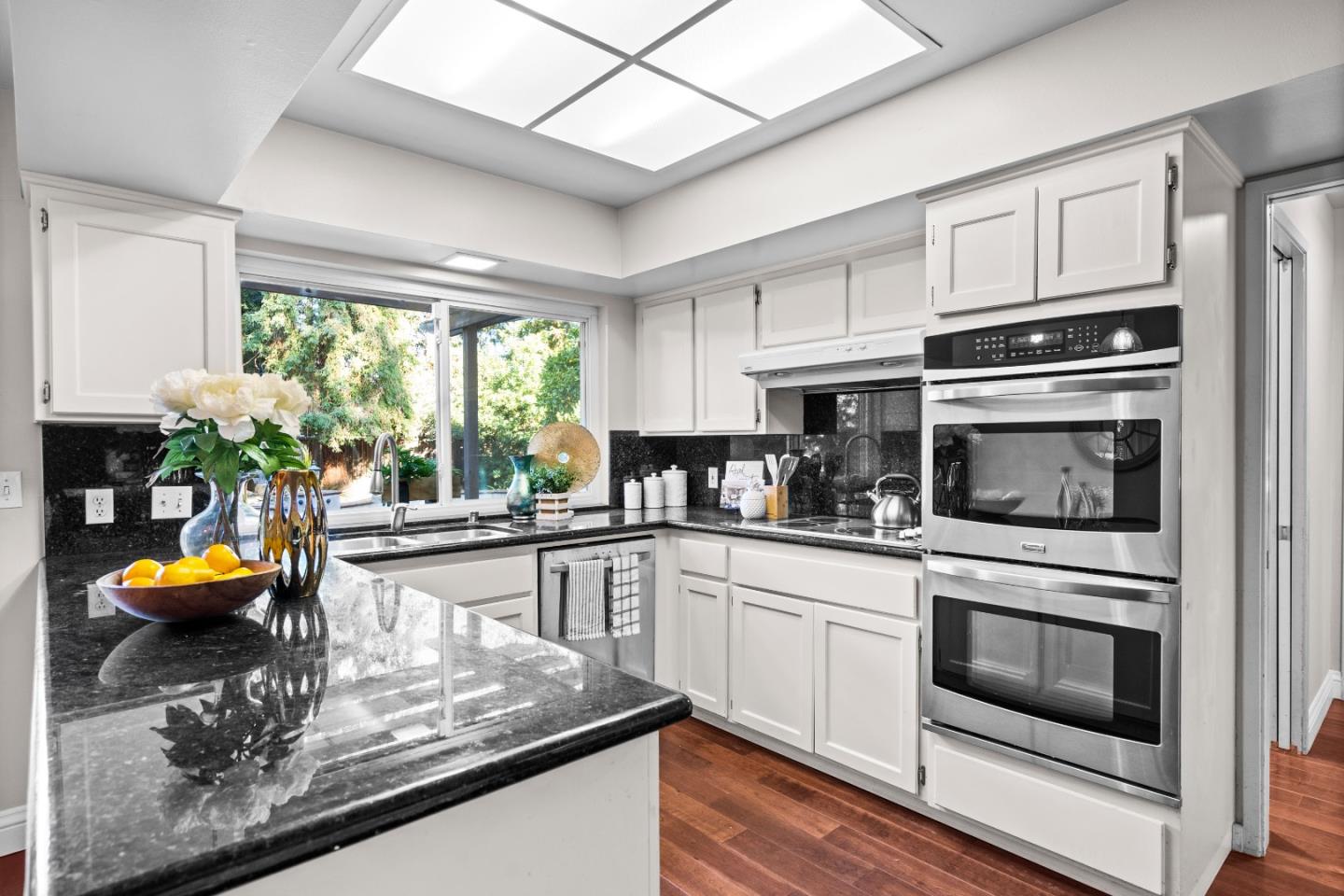 775 Steuben Drive Sunnyvale, CA 94087 - Photo 10 of 37 a kitchen with stainless steel appliances granite countertop a stove a sink and a microwave