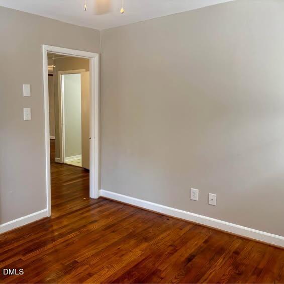 1505 Old Ivey Road Apex, NC 27523 - Photo 6 of 10 a view of an empty room with wooden floor