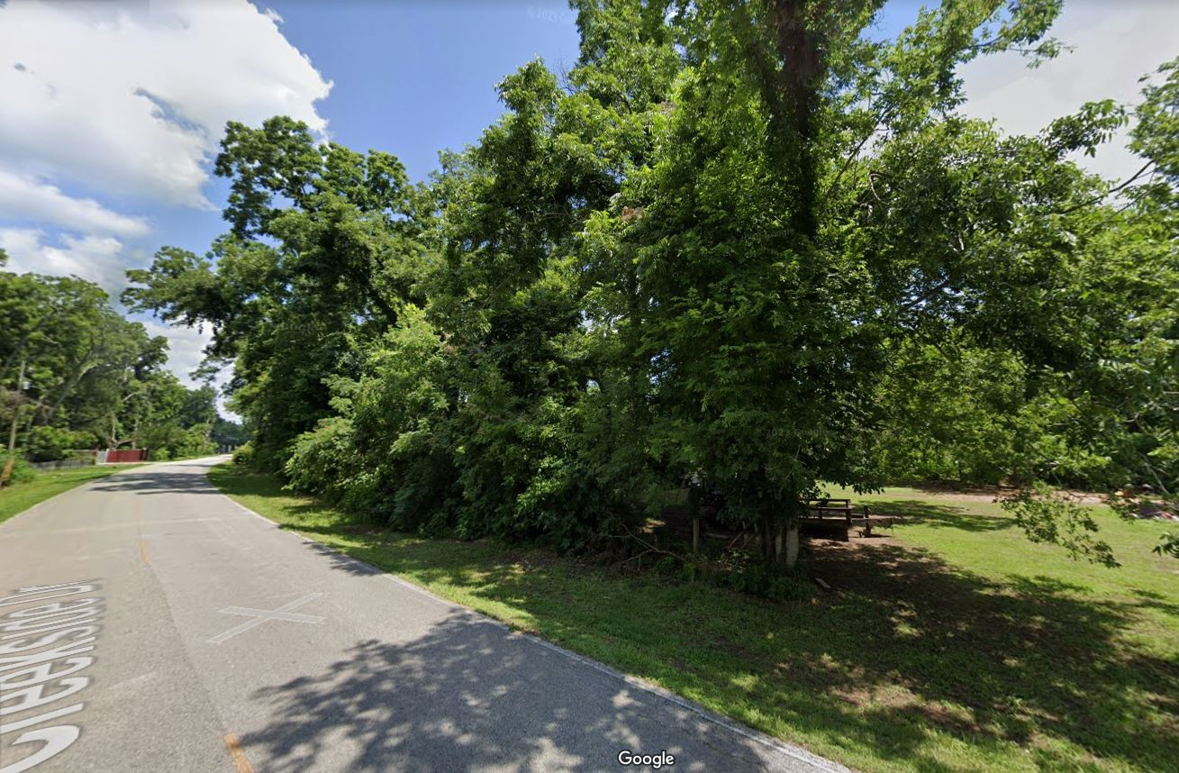 0 Creekside Drive Angleton, TX 77515 - Photo 2 of 5 a view of a street with a bench