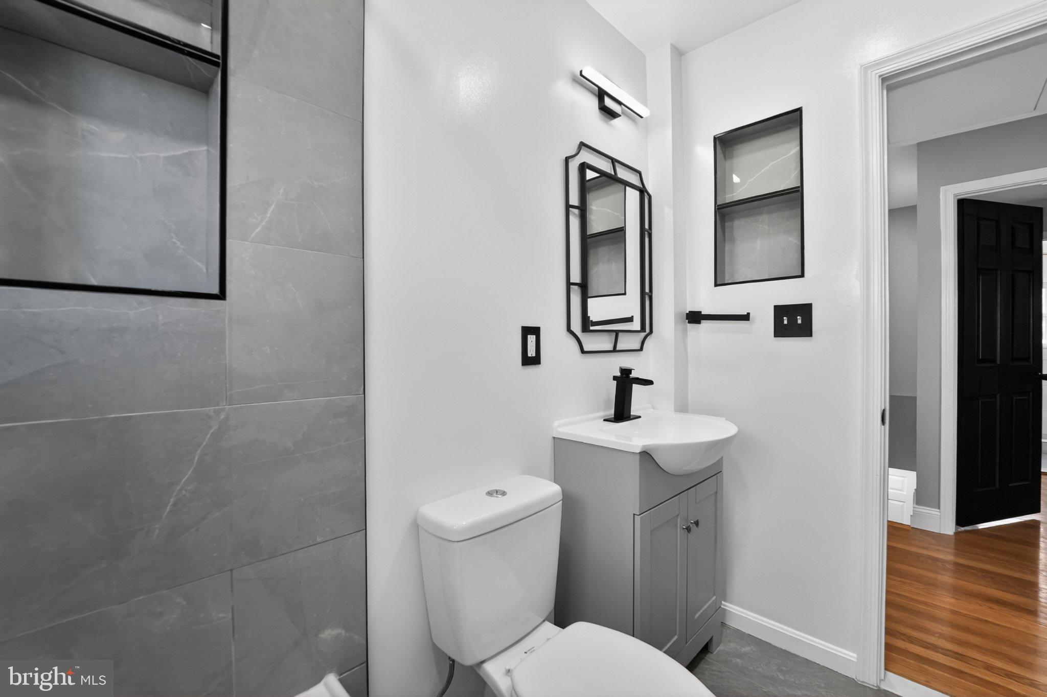 643 South Wickham Road Baltimore, MD 21229 - Photo 27 of 32 Sleek modern bathroom with stylish accents.