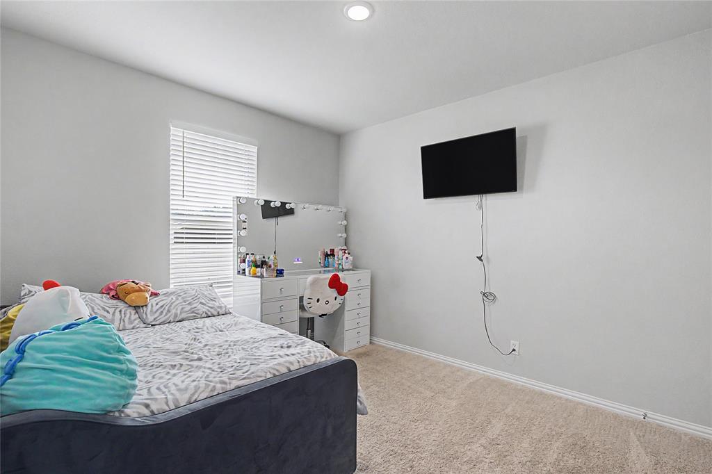 185 Chester Road Springtown, TX 76082 - Photo 29 of 40 Carpeted room featuring a single window with horizontal blinds, neutral wall paint, and white baseboards