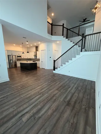 a view of a living room hardwood and kitchen view