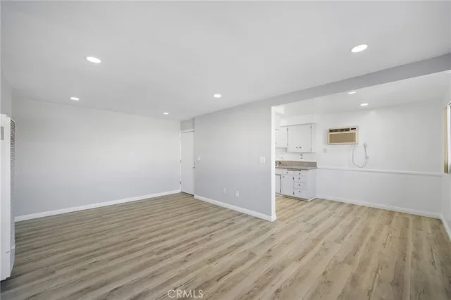 a view of a kitchen with wooden floor