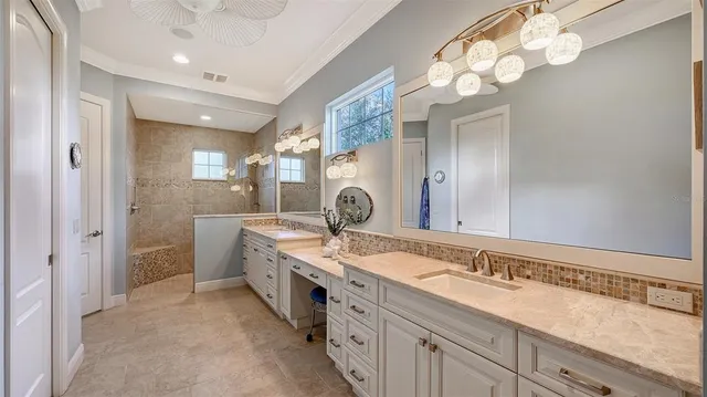 a living room with furniture a window and a flat screen tv