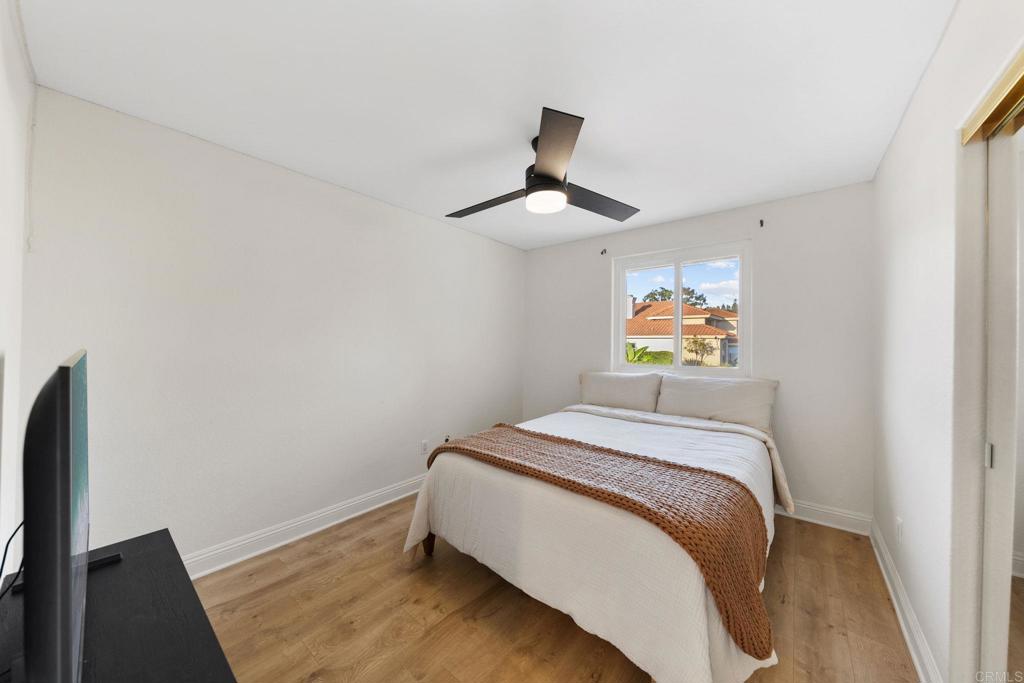 1838 Samoa Way Oceanside, CA 92054 - Photo 25 of 40 a bedroom with a bed and a painting on the wall