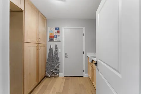 a view of walk in closet with clothes