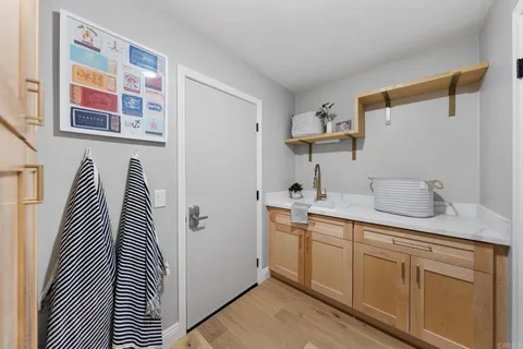 a kitchen with stainless steel appliances a sink and cabinets