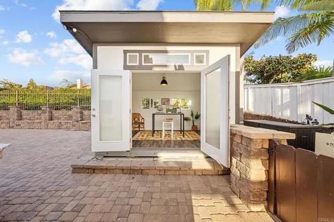 a front view of a house with a outdoor space