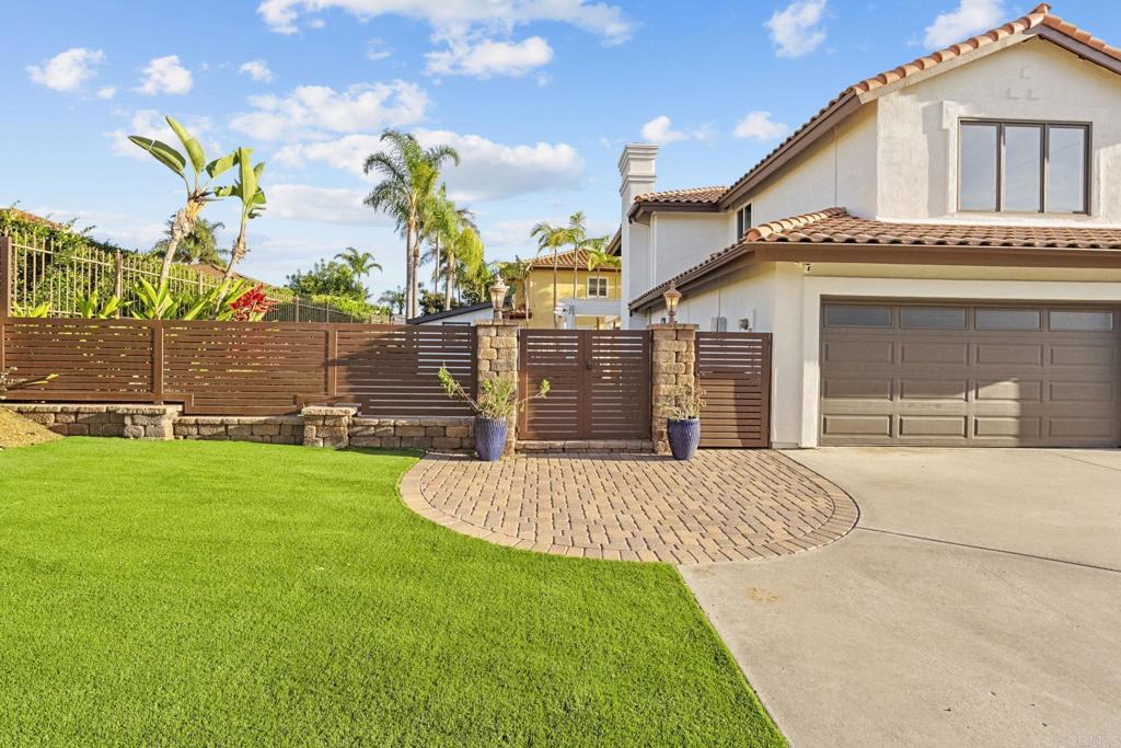 1838 Samoa Way Oceanside, CA 92054 - Photo 3 of 40 a front view of a house with a garden