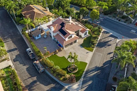 an aerial view of a house with outdoor space