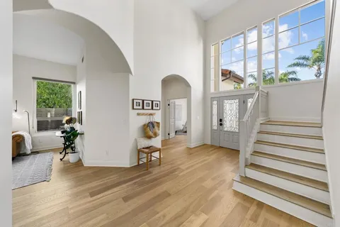 a view of a livingroom with furniture and staircase