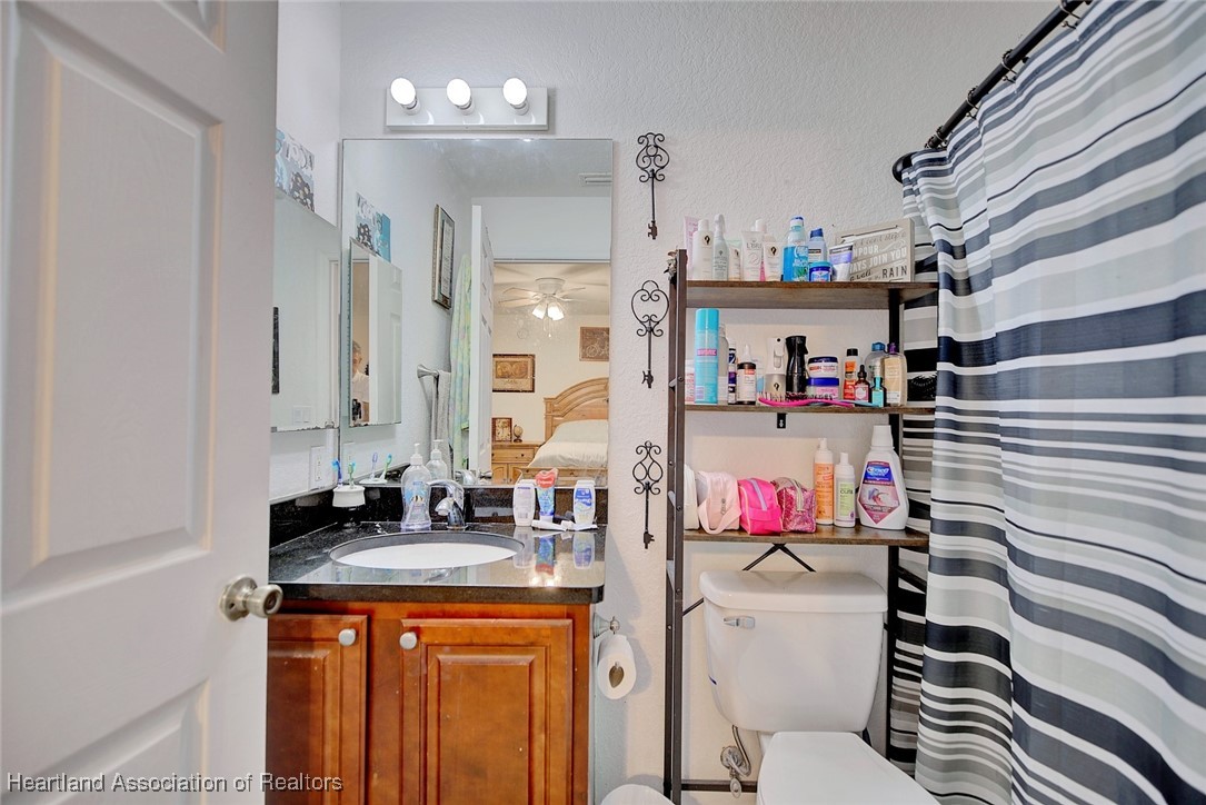 1700 Schlosser Road Sebring, FL 33870 - Photo 28 of 40 a bathroom with a sink and a mirror