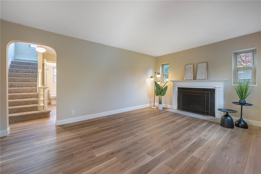 1012 Hampshire Road Dayton, OH 45419 - Photo 7 of 39 This bright living space features elegant flooring and a stately fireplace, ready for cozy evenings.